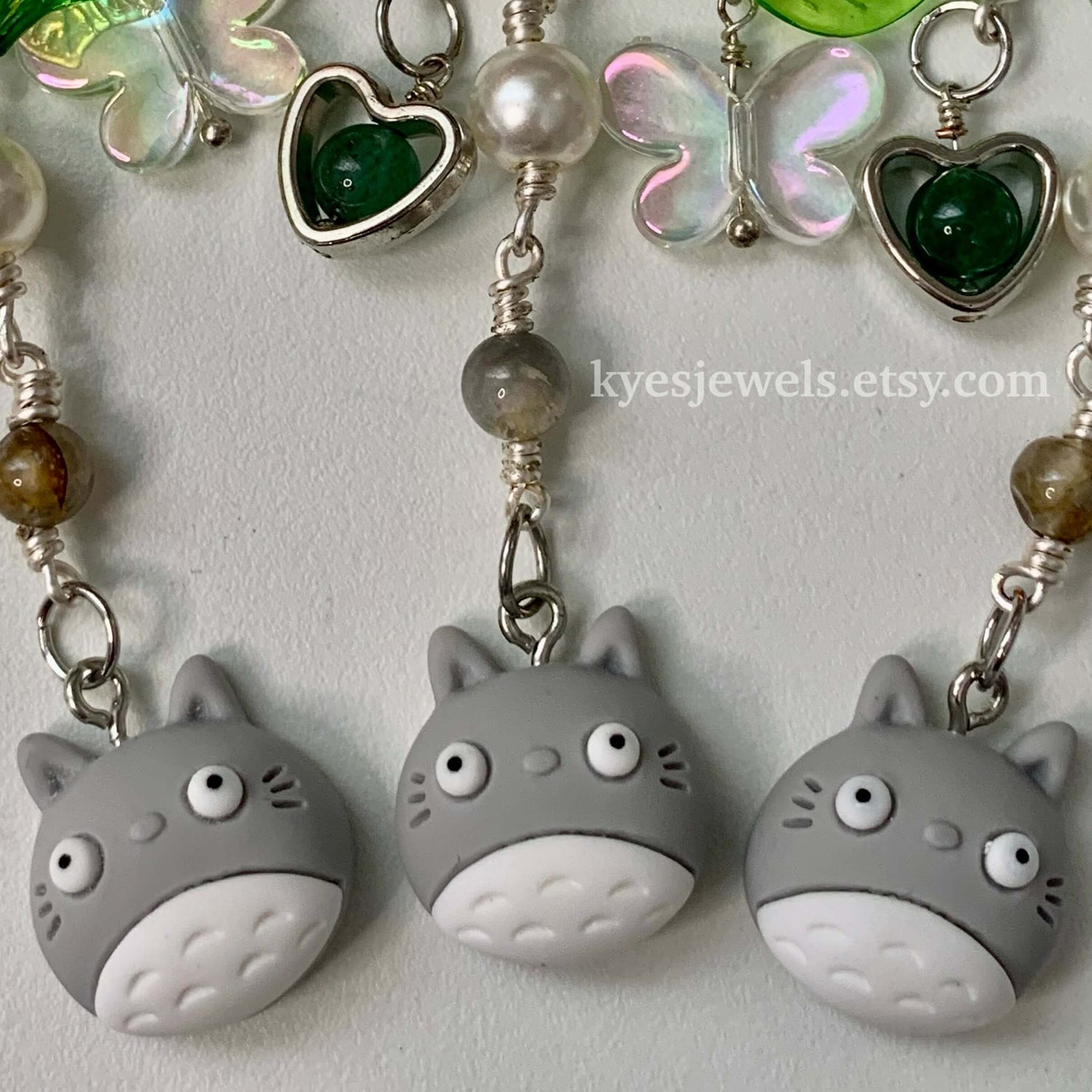 3 chibi Totoro keychains lying flat